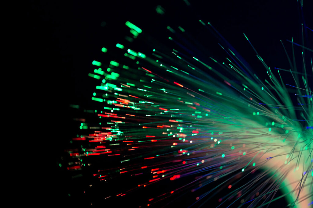 How do an optical fiber transmit information through light